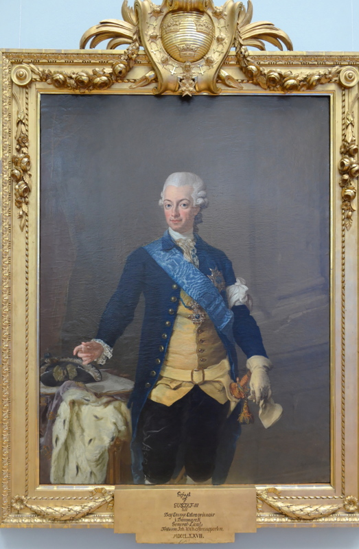 11 - A portrait of King Gustav III of Sweden by Lorens Pasch the Younger, featuring his royal blue uniform and an ornate gilded frame